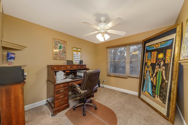 carpeted office featuring ceiling fan