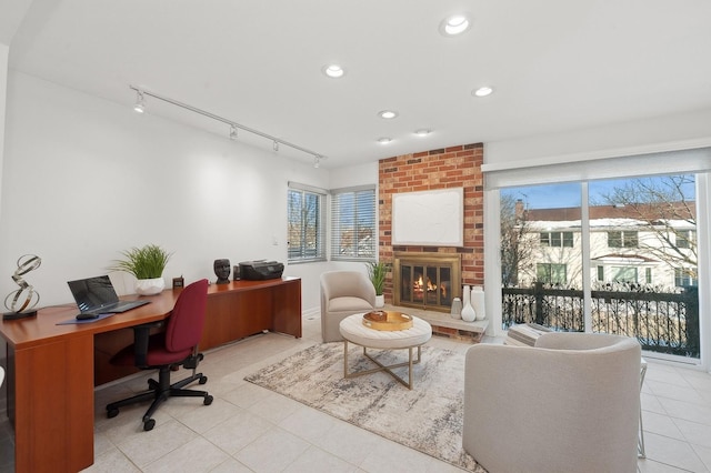 home office featuring recessed lighting, a fireplace, and light tile patterned floors