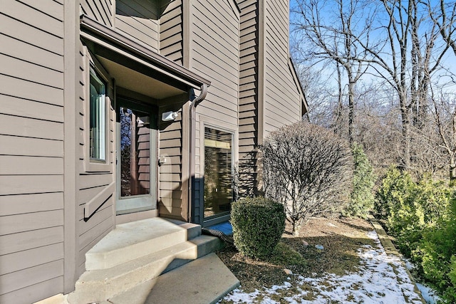 view of snow covered property entrance