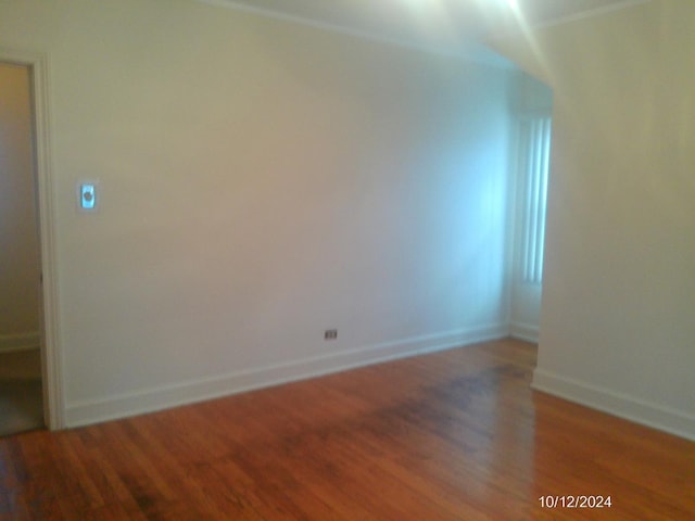 unfurnished room with hardwood / wood-style floors