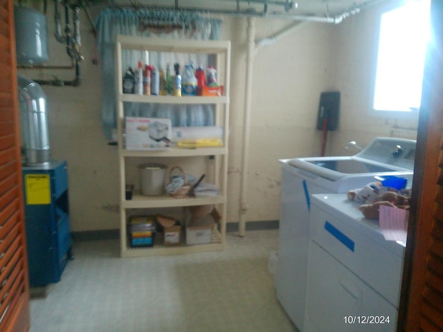 washroom with washing machine and clothes dryer