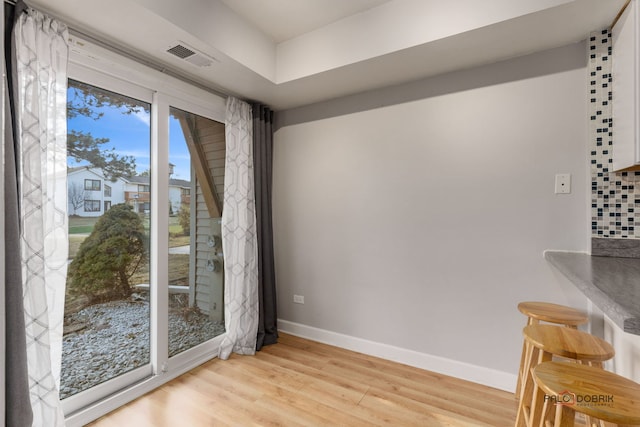 unfurnished dining area featuring light hardwood / wood-style floors