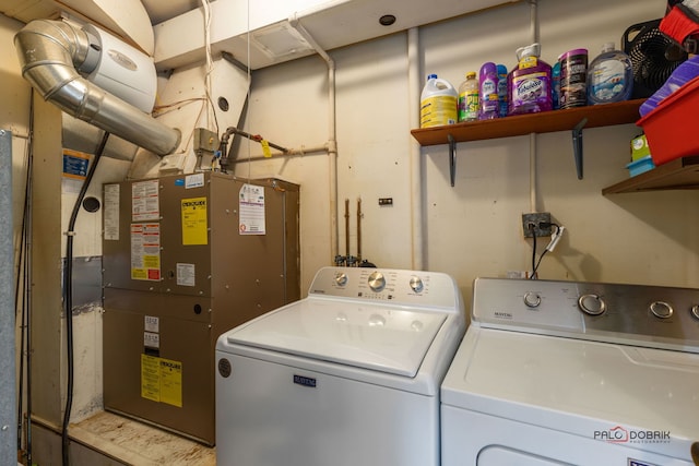 washroom with heating unit and washing machine and dryer