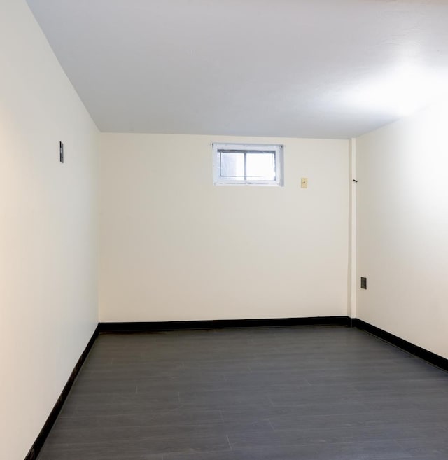 spare room featuring dark hardwood / wood-style flooring