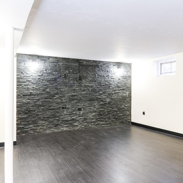 basement featuring dark hardwood / wood-style floors