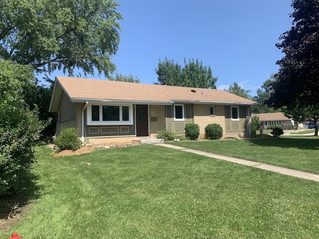 ranch-style house with a front lawn