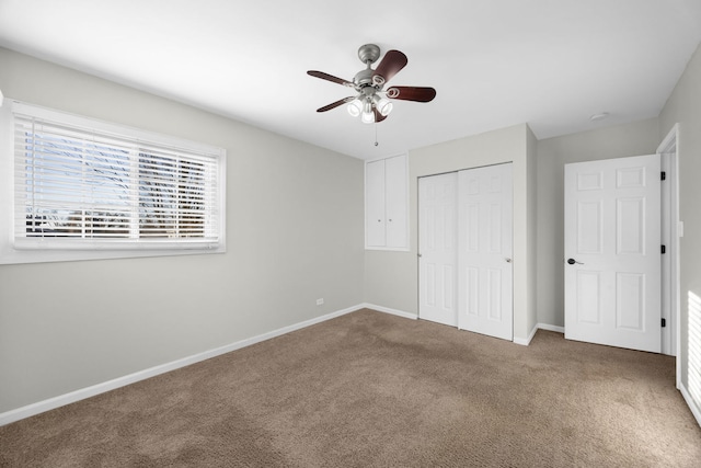 unfurnished bedroom featuring a closet, ceiling fan, and carpet flooring