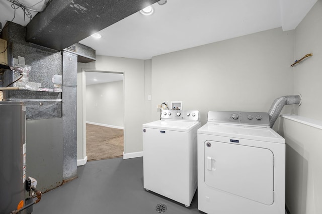 laundry room featuring independent washer and dryer and water heater