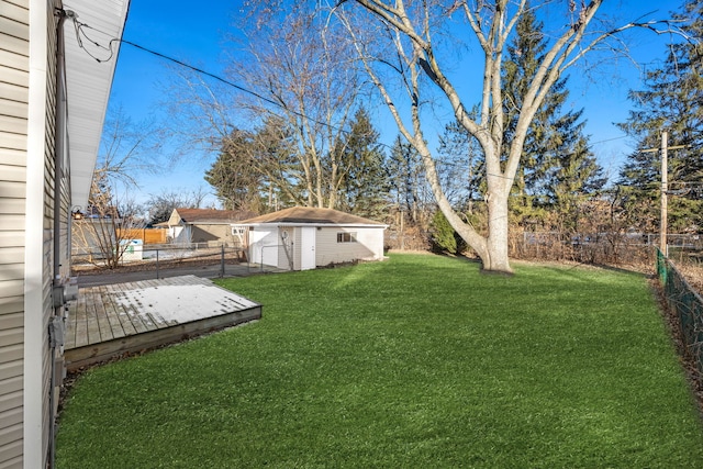 view of yard featuring a deck and a shed