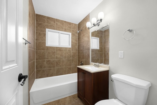 full bathroom featuring tiled shower / bath combo, vanity, tile patterned floors, and toilet