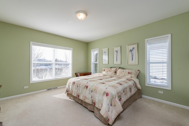 bedroom with light colored carpet