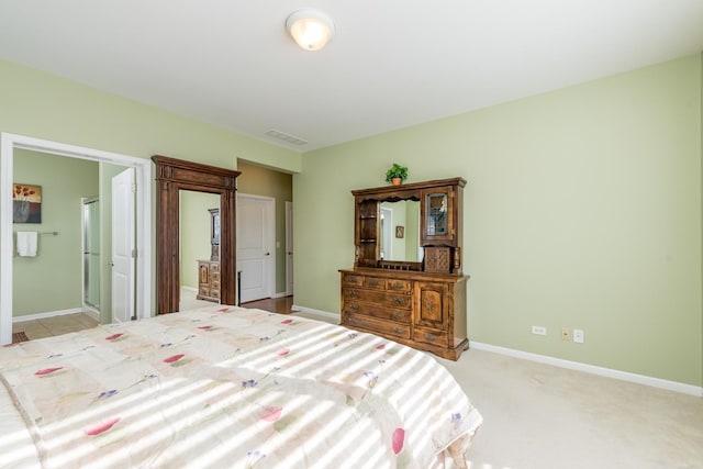 bedroom with light colored carpet