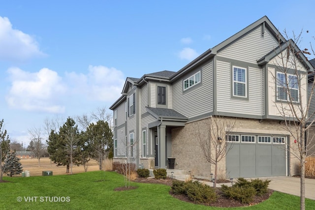 view of home's exterior featuring brick siding, a lawn, driveway, and an attached garage