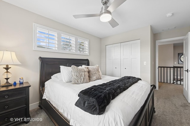 carpeted bedroom featuring ceiling fan, visible vents, and a closet