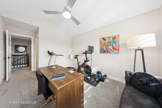 office area featuring a ceiling fan, carpet flooring, vaulted ceiling, and baseboards