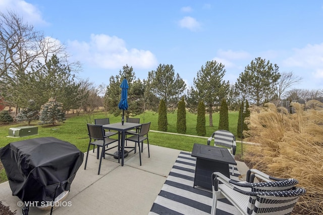 view of patio with outdoor dining space and grilling area