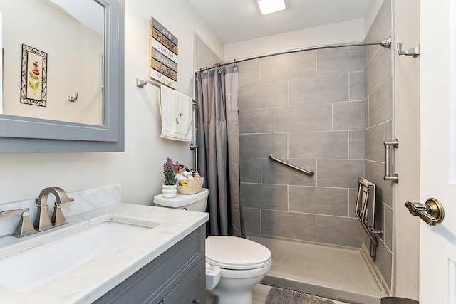 bathroom with vanity, toilet, and walk in shower