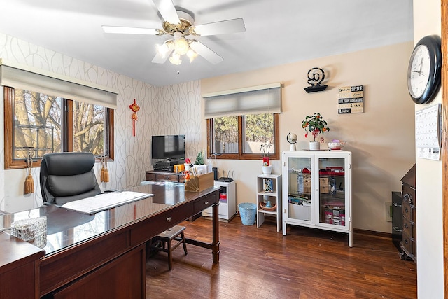 home office featuring dark wood-type flooring and ceiling fan