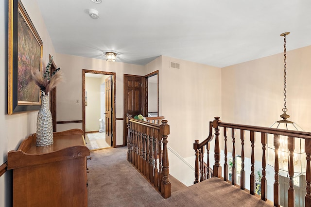 corridor featuring carpet floors