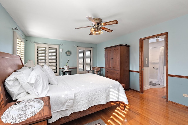 bedroom featuring ceiling fan, connected bathroom, and light wood-type flooring