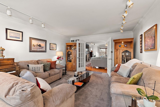 living room featuring track lighting, ornamental molding, and french doors