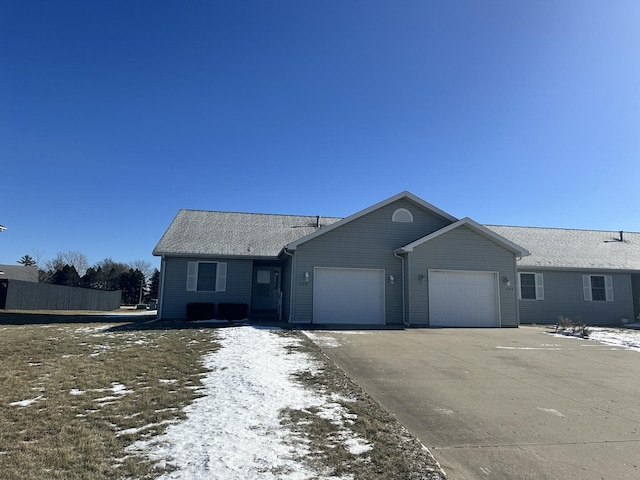 single story home featuring a garage