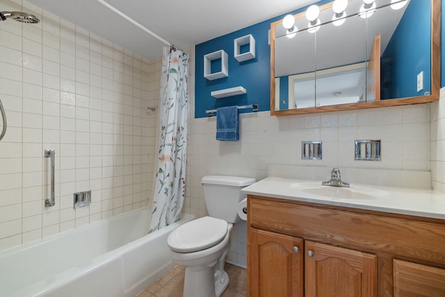 full bathroom with toilet, shower / tub combo, tile walls, vanity, and tile patterned flooring