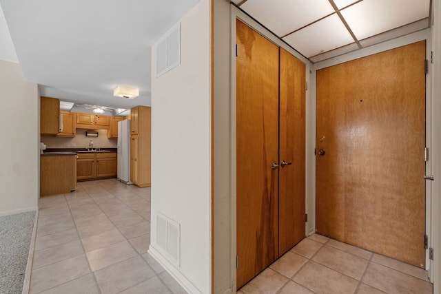 hallway with light tile patterned floors