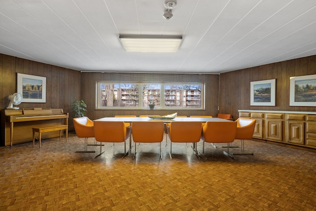 interior space featuring parquet floors and wooden walls