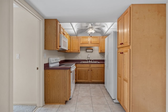 kitchen featuring sink, white appliances, ceiling fan, and light tile patterned flooring