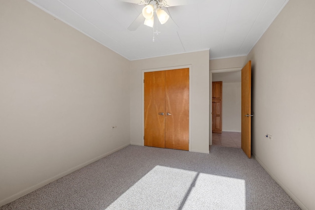 unfurnished bedroom featuring carpet floors and ceiling fan