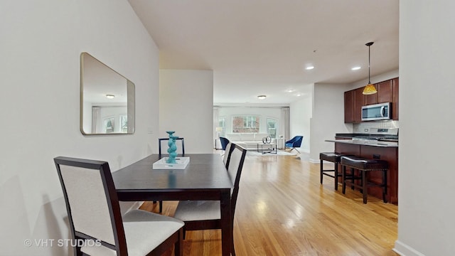 dining space featuring light hardwood / wood-style flooring