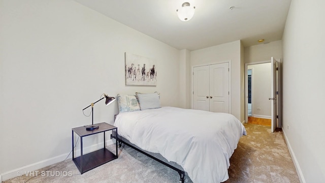 bedroom with carpet floors and a closet