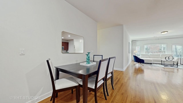 dining area with light hardwood / wood-style flooring