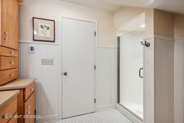 bathroom featuring vanity and an enclosed shower