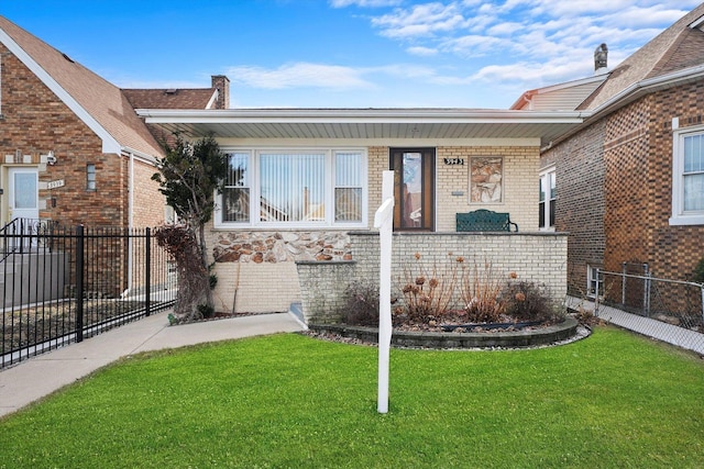 view of front of home with a front lawn