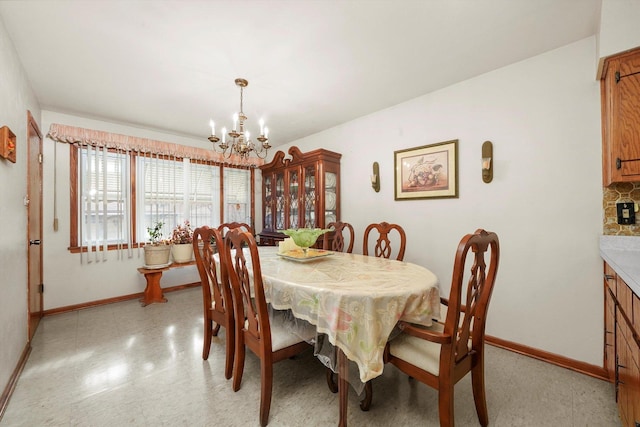 dining room featuring a notable chandelier