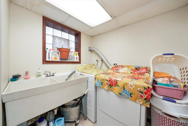 laundry room with sink and light tile patterned floors