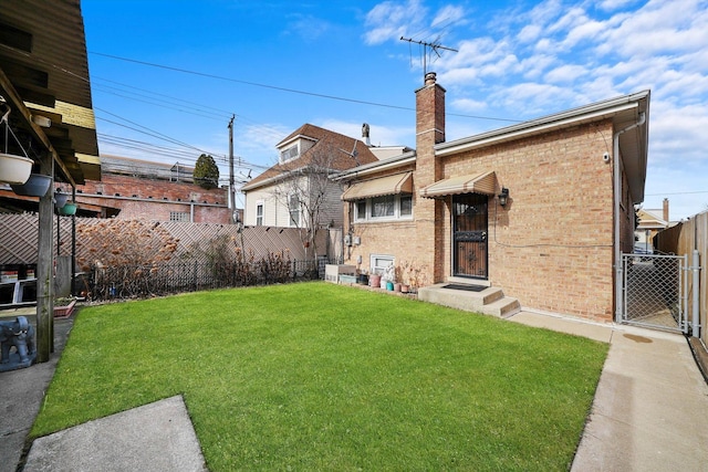 back of house with a lawn