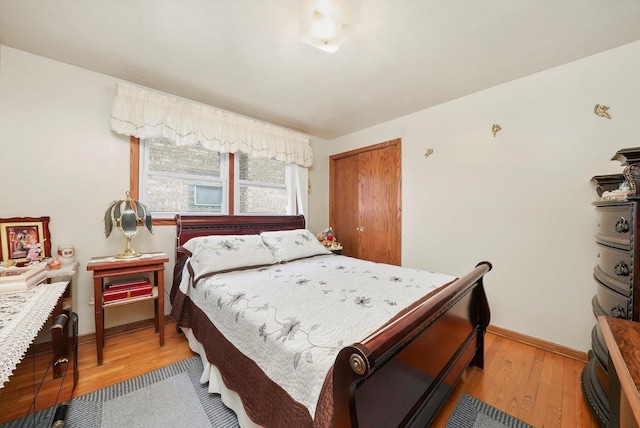 bedroom with a closet and light wood-type flooring