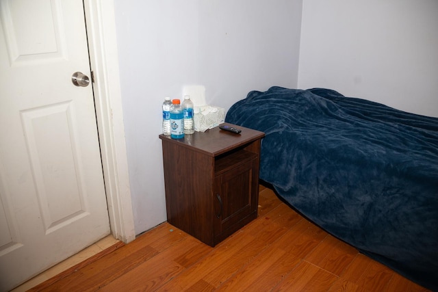 bedroom with hardwood / wood-style floors