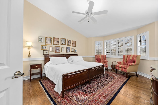 bedroom featuring vaulted ceiling, hardwood / wood-style floors, and ceiling fan