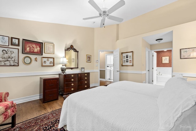 bedroom with hardwood / wood-style floors, ensuite bath, and ceiling fan