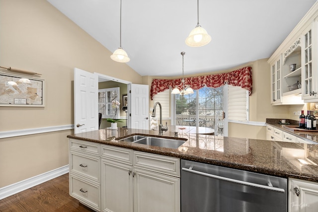 kitchen with white cabinetry, sink, dark hardwood / wood-style flooring, hanging light fixtures, and stainless steel dishwasher