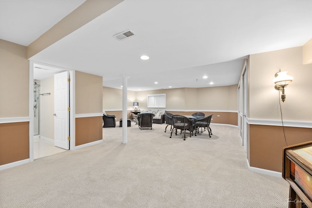 dining room with light colored carpet