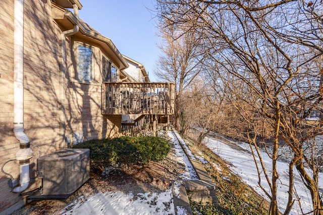 exterior space with cooling unit and a deck