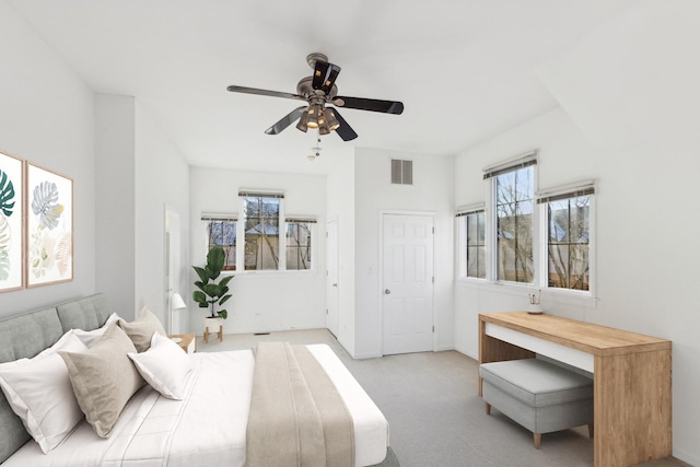 bedroom with light carpet and ceiling fan