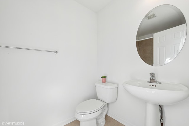 bathroom featuring tile patterned floors and toilet