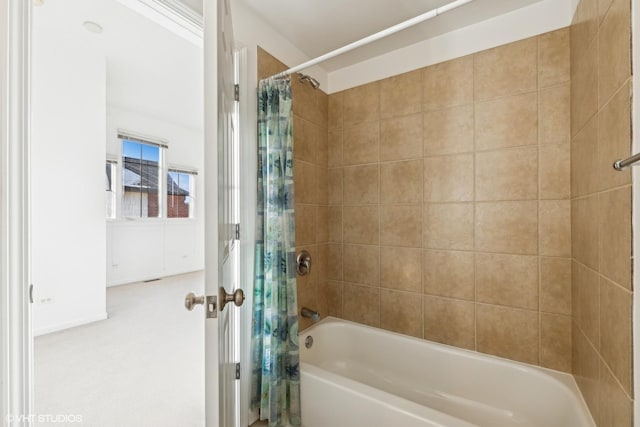 bathroom with shower / bath combination with curtain