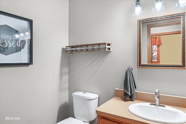 bathroom with vanity and toilet